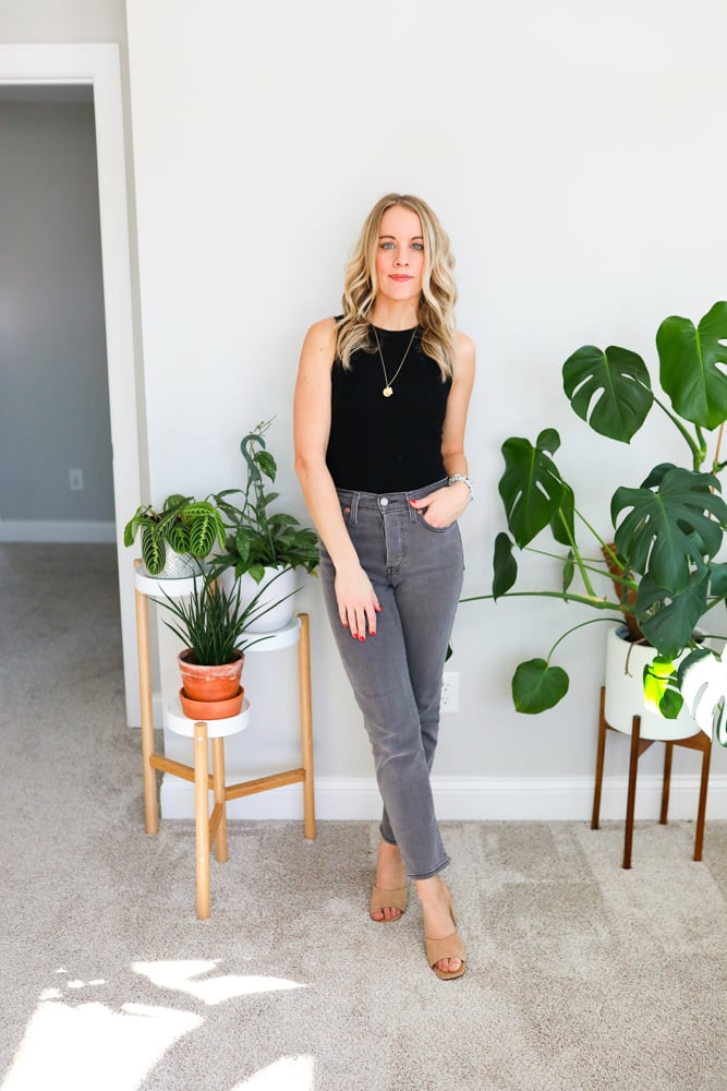 black bodysuit and grey jeans