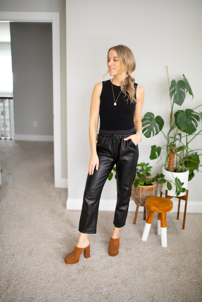 black bodysuit and faux leather joggers