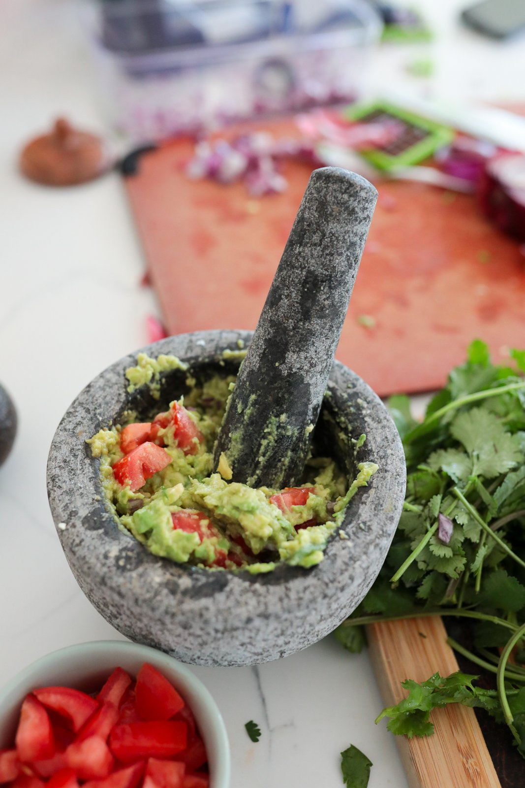Unpolished granite mortar and pestle set with a sturdy 6-inch bowl and pestle, sitting on a countertop with anti-scratch protector underneath.