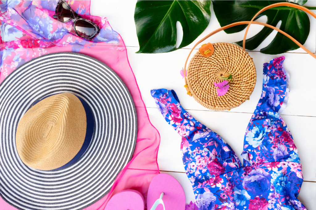 Swimsuit, hat, sandals, bag flat lay