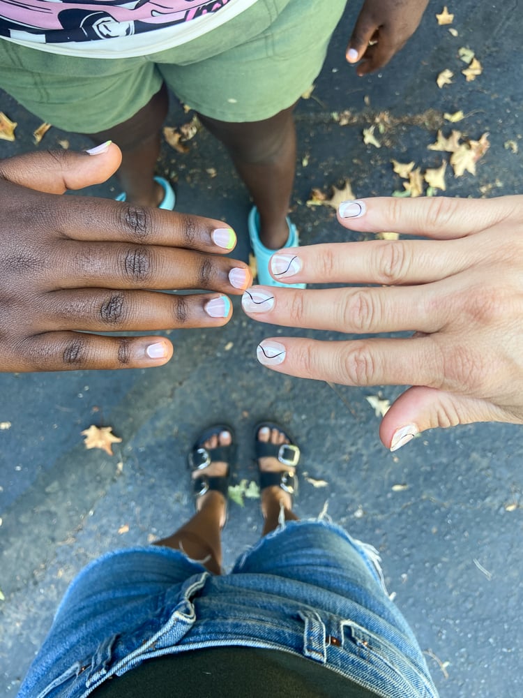 2 women wearing ohora nails