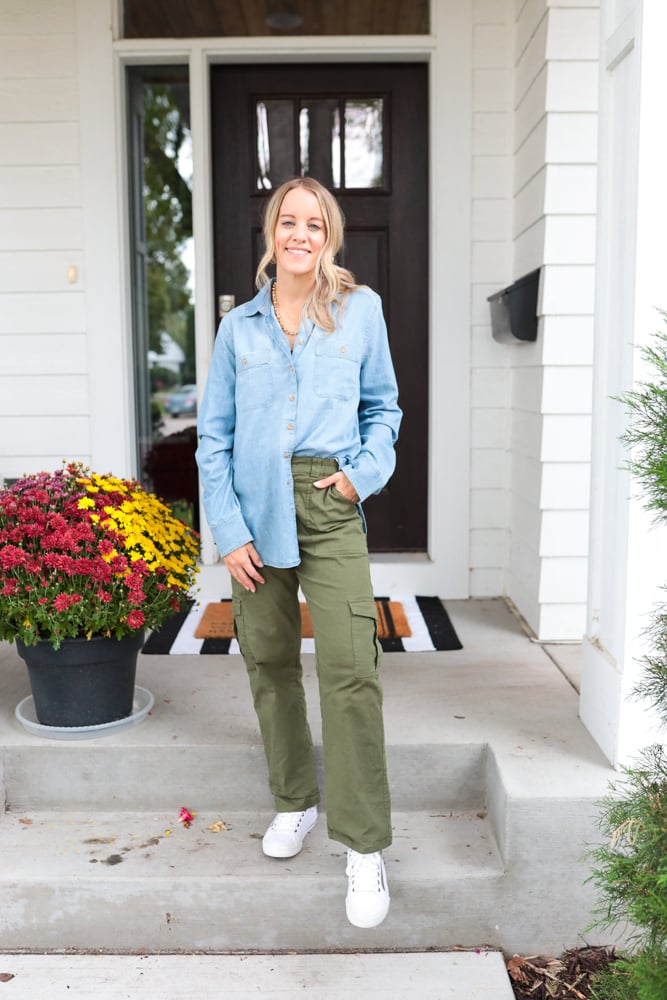 woman wearing green cargo pants, chambray and white sneakers