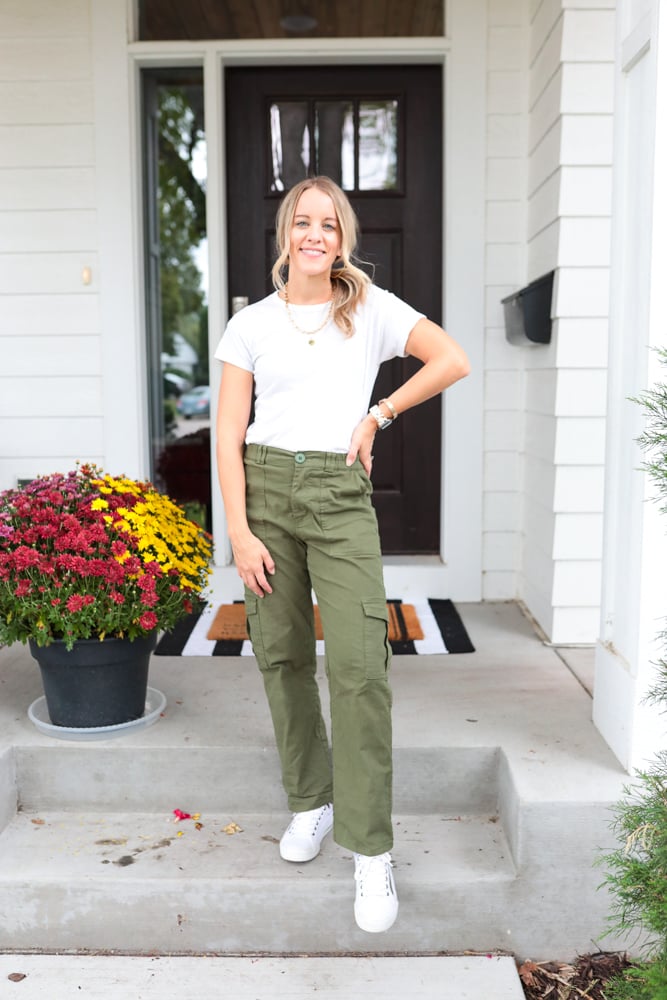 woman wearing green cargo pants, white t-shirt and white sneakers