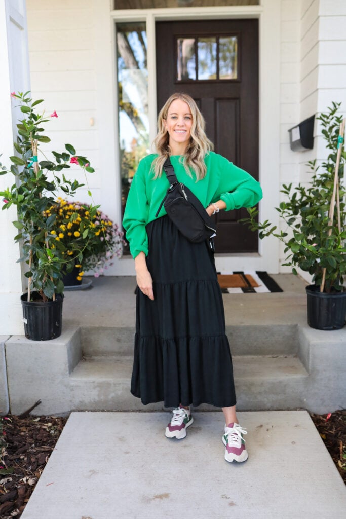 woman wearing maxi dress with sweatshirt and new balance sneakers