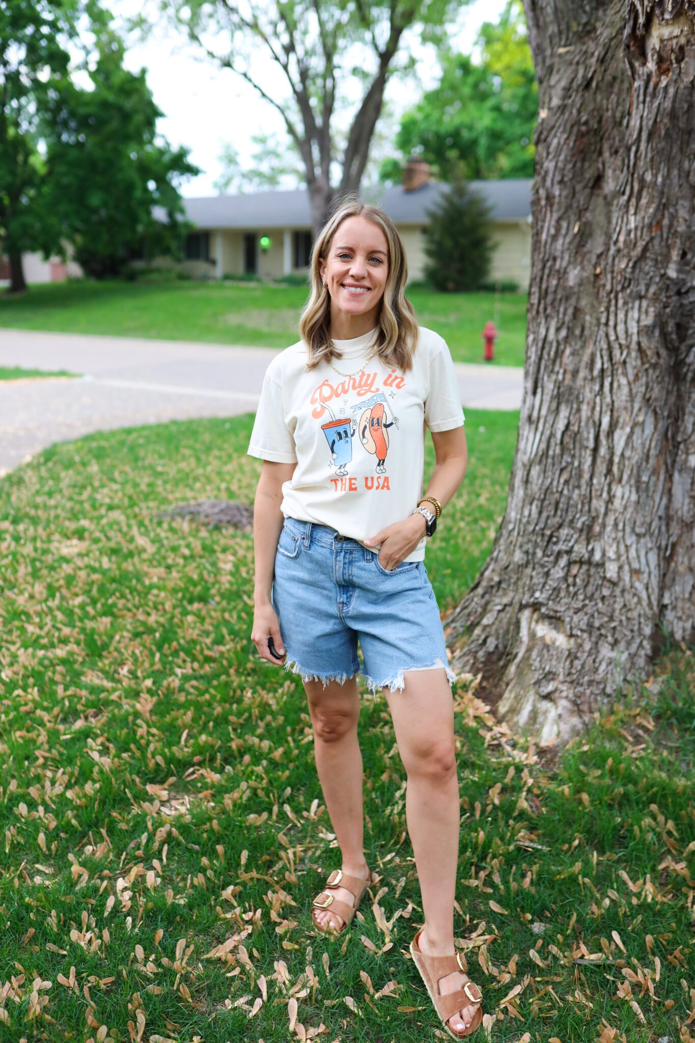 Vintage Party in the USA tee paired with laid-back shorts and brown Birkenstocks for a cute and comfy 4th of July outfit.