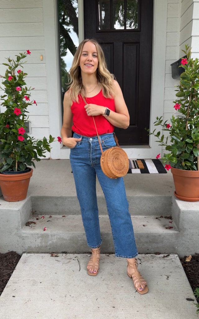 Woman wearing jeans and tank 4th of july outfit.