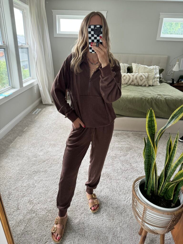 Woman in brown track suit.