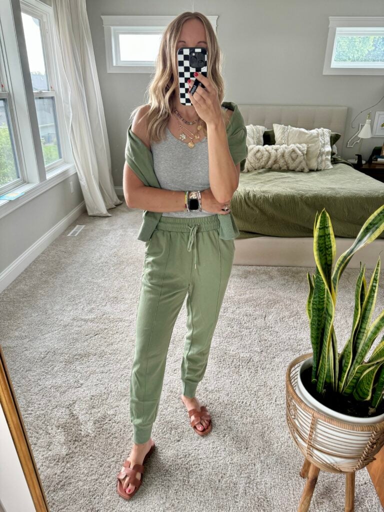 Woman in green lounge pants, grey tank and matching green sweatshirt