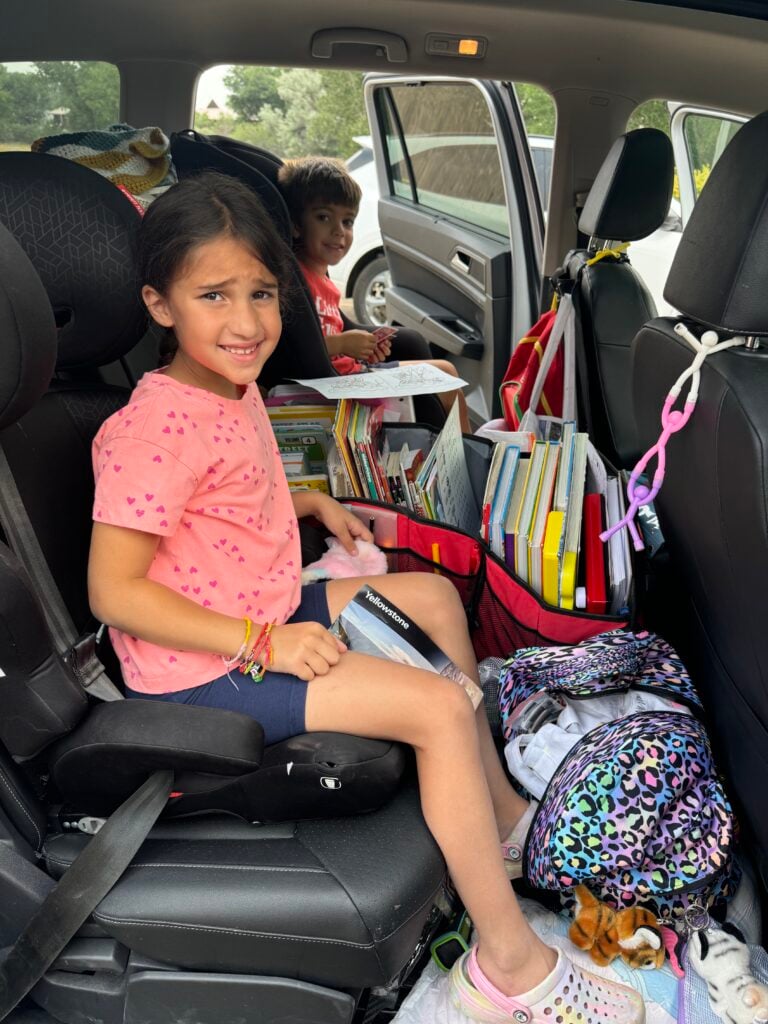 Kids in back of car on a road trip.