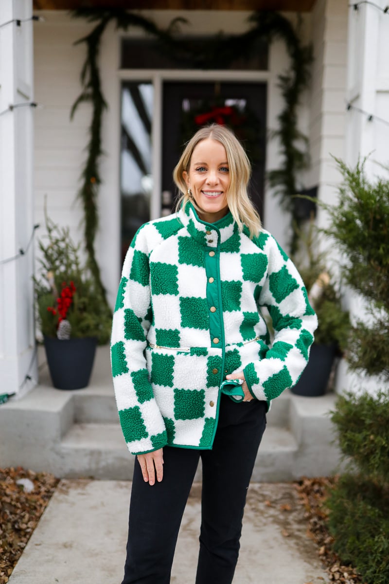 Woman in white and green checkered jacket.