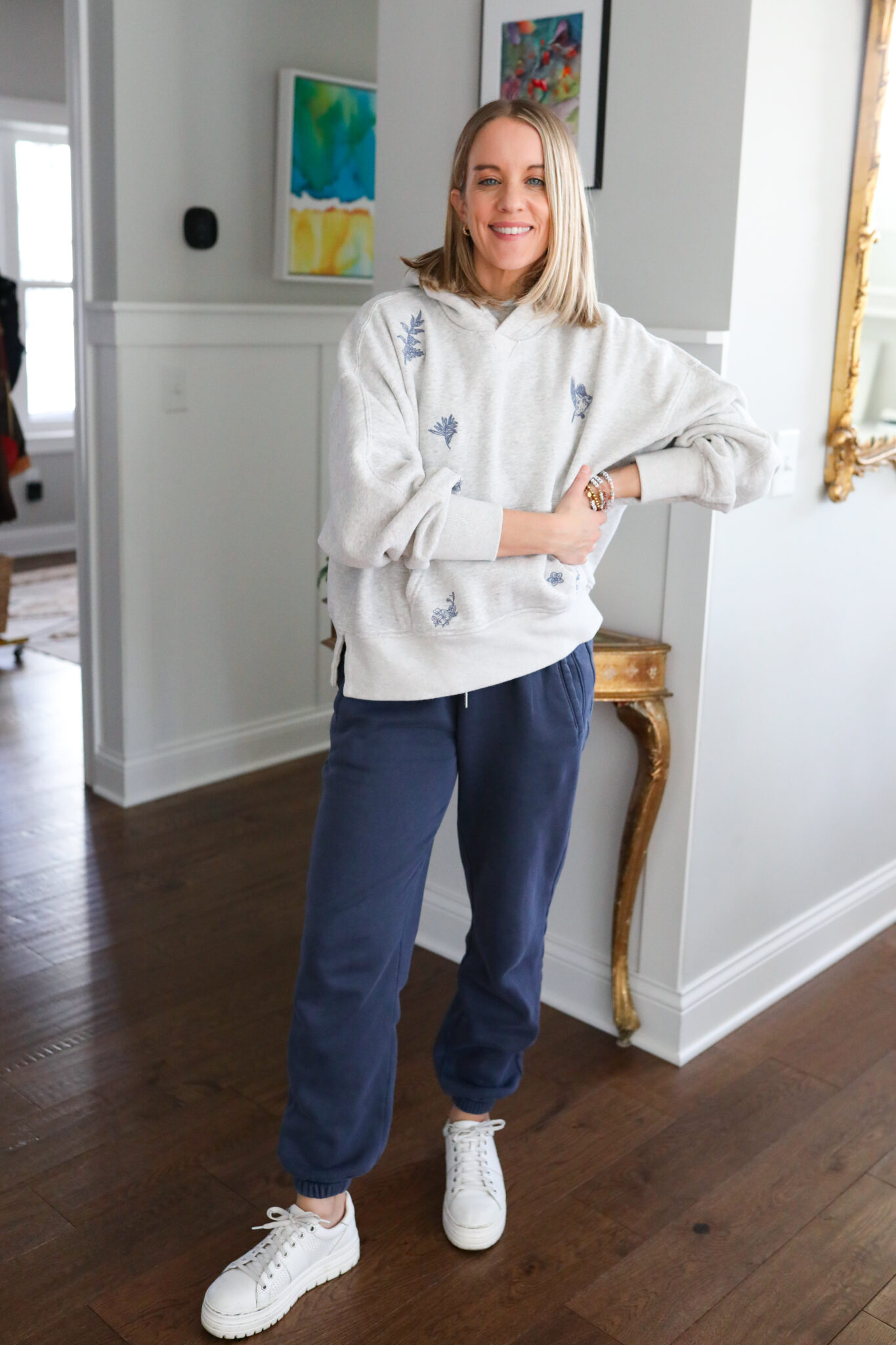 woman wearing Abercrombie gray hoodie and blue sweat pants