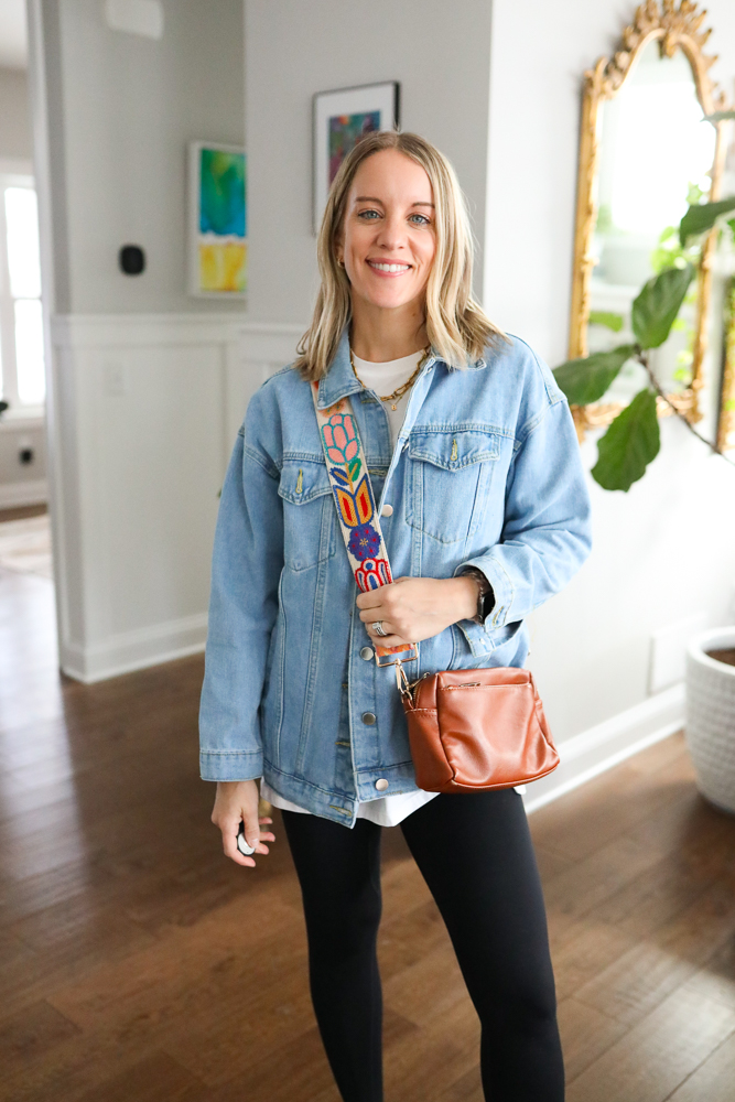 woman wearing light wash denim jacket