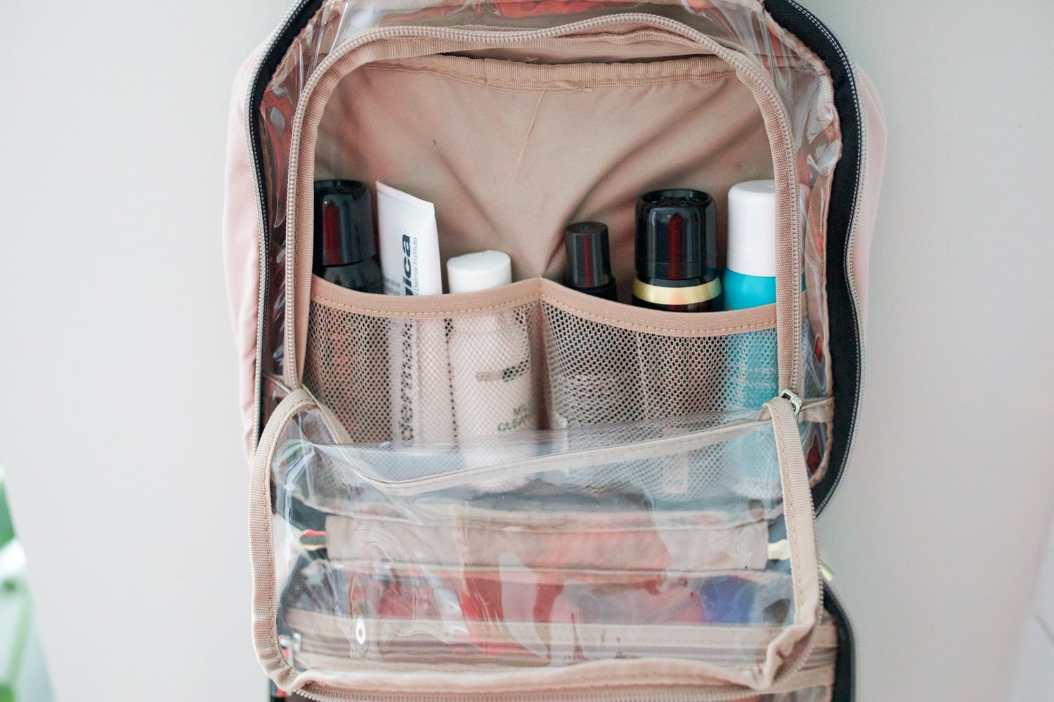 travel essentials featuring a toiletry packing bag