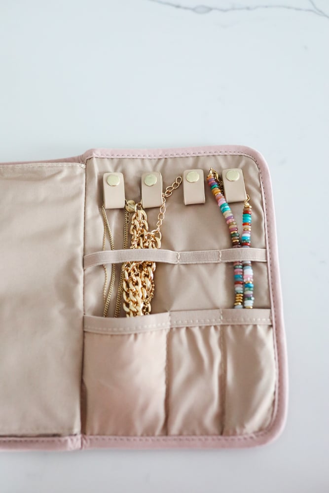 travel essentials featuring a jewelry organizing travel bag