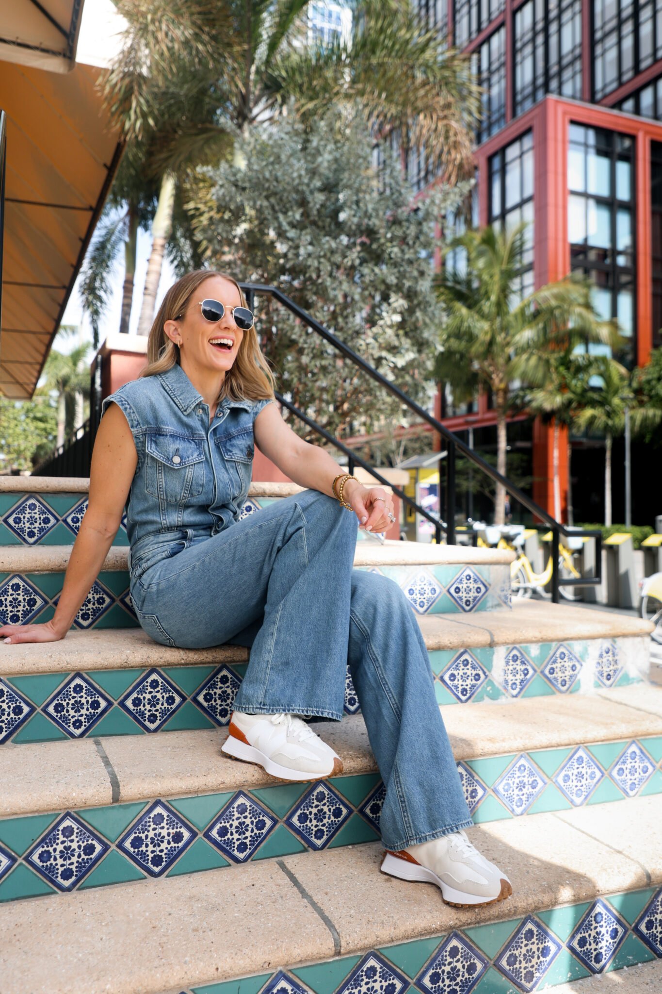 woman wearing denim jumpsuit