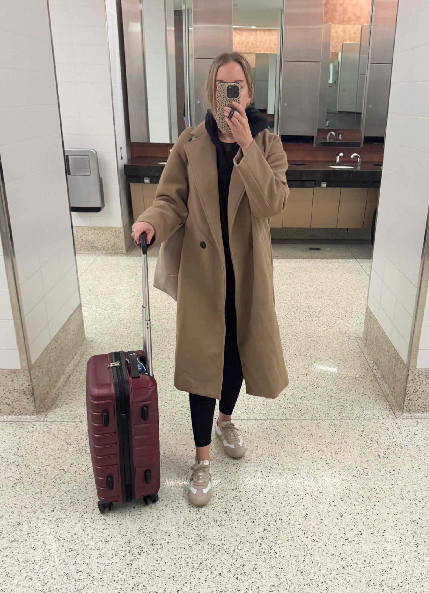 Woman in tan jacket traveling