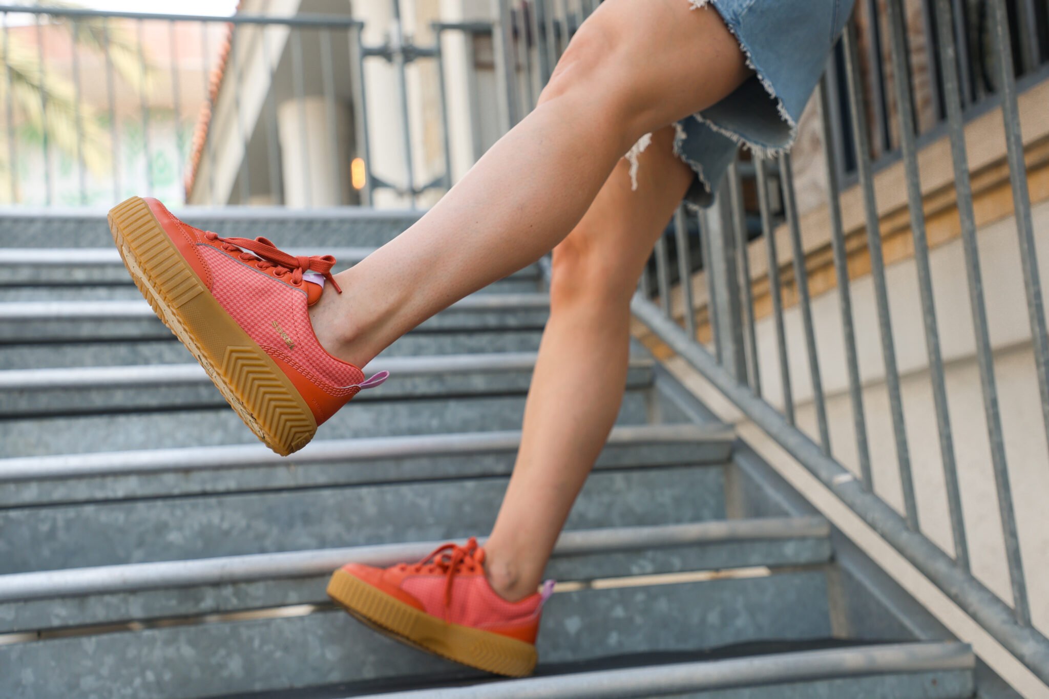 woman wearing shorts and sneakers