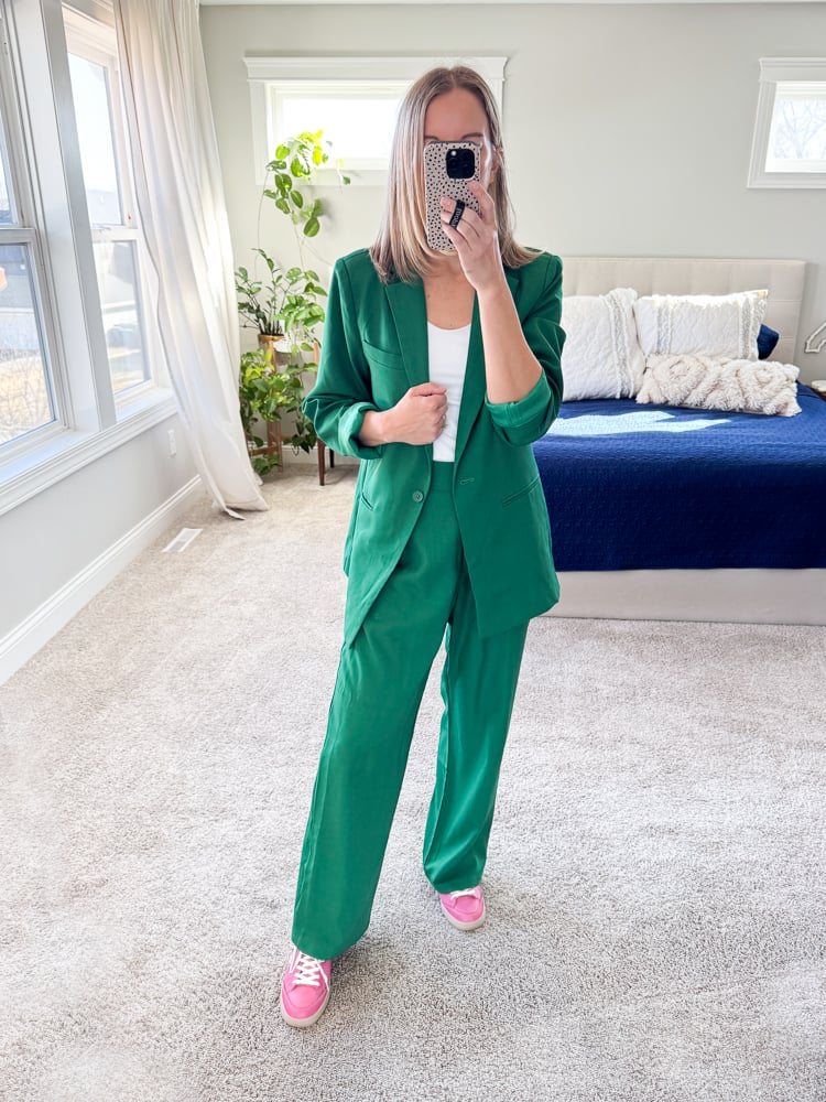 woman wearing green blazer set with pink sneakers