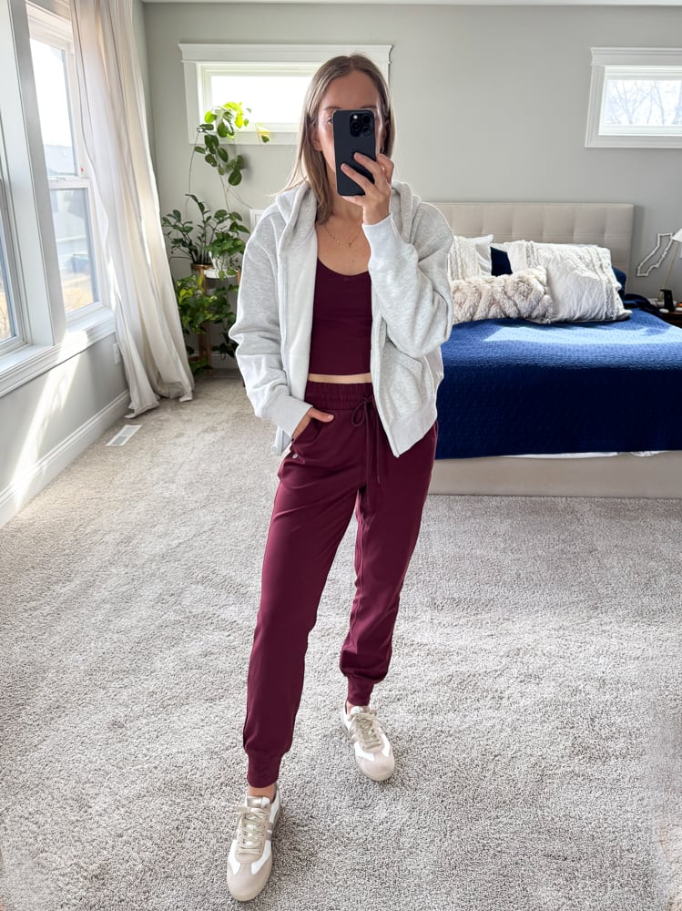 woman wearing maroon work out set and lace up shoes