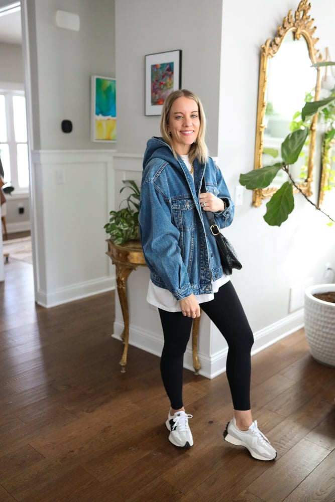 woman wearing hooded denim jacket and leggings