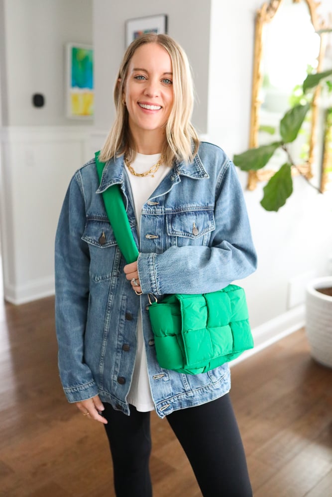 woman wearing dark denim jacket with a casual outfit