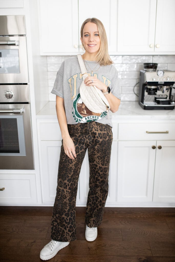 woman wearing leopard print pants and graphic tee