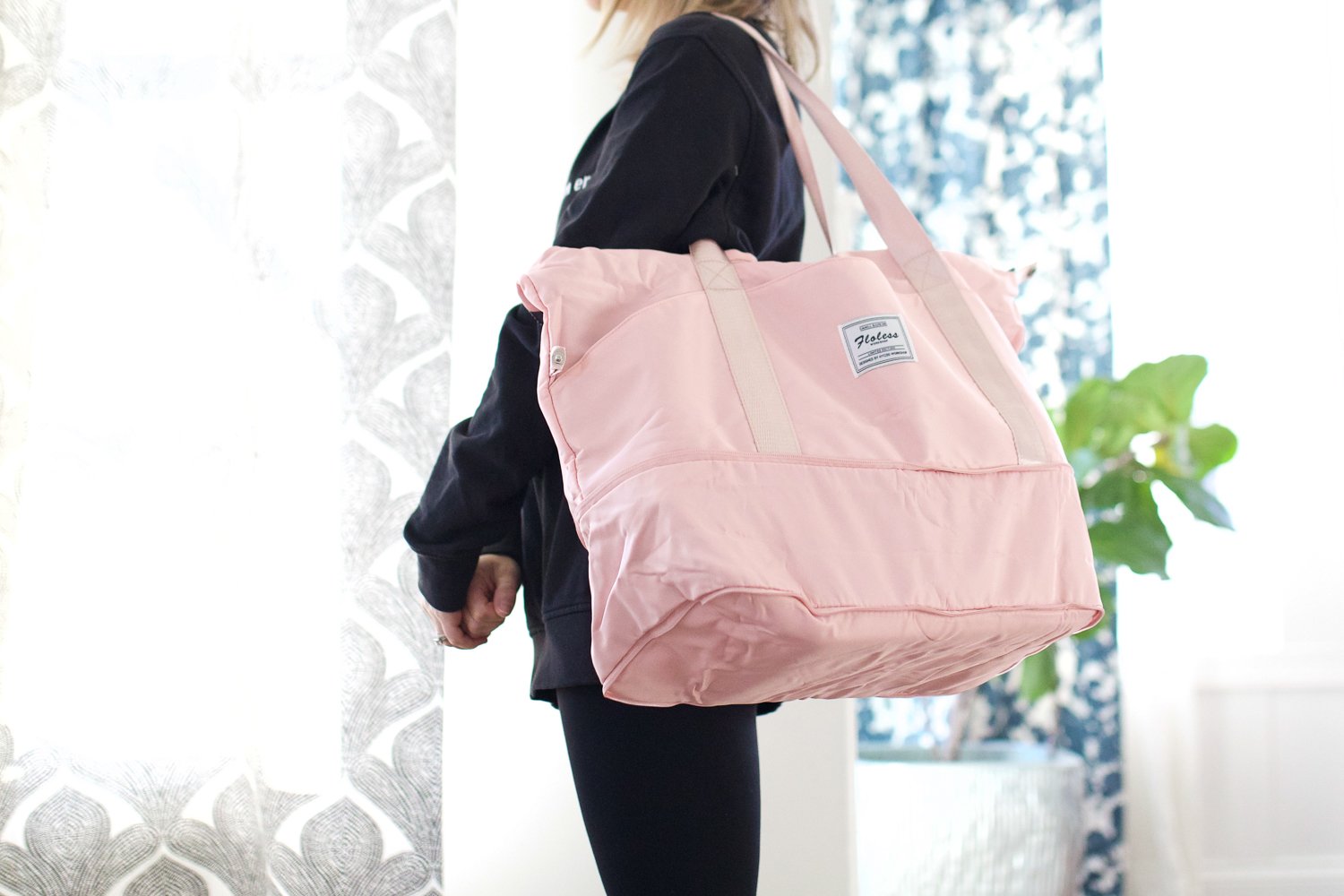 Woman holding a pink sports bag