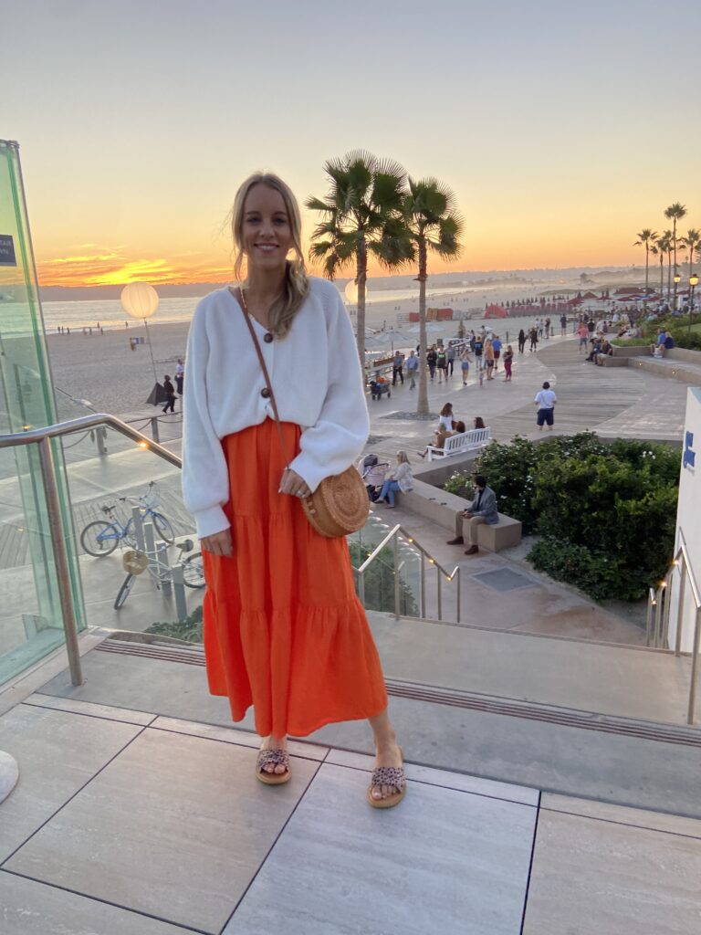 white cardigan, sweater, orange maxi dress, sandals, summer bag, woven corssbody