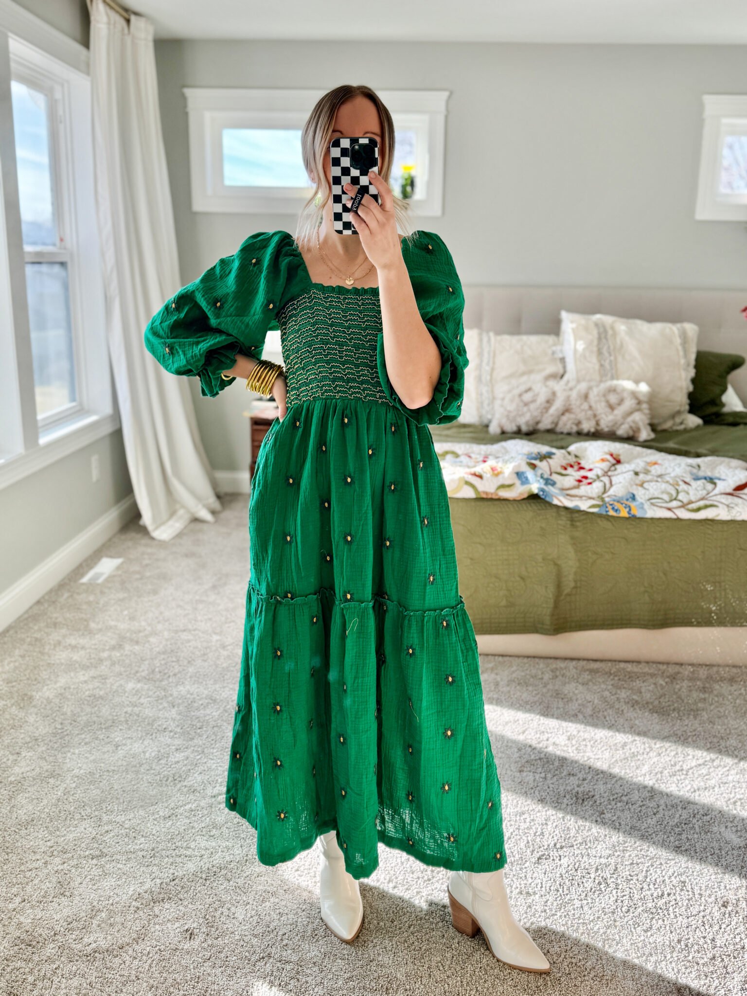 woman wearing green maxi dress and boots