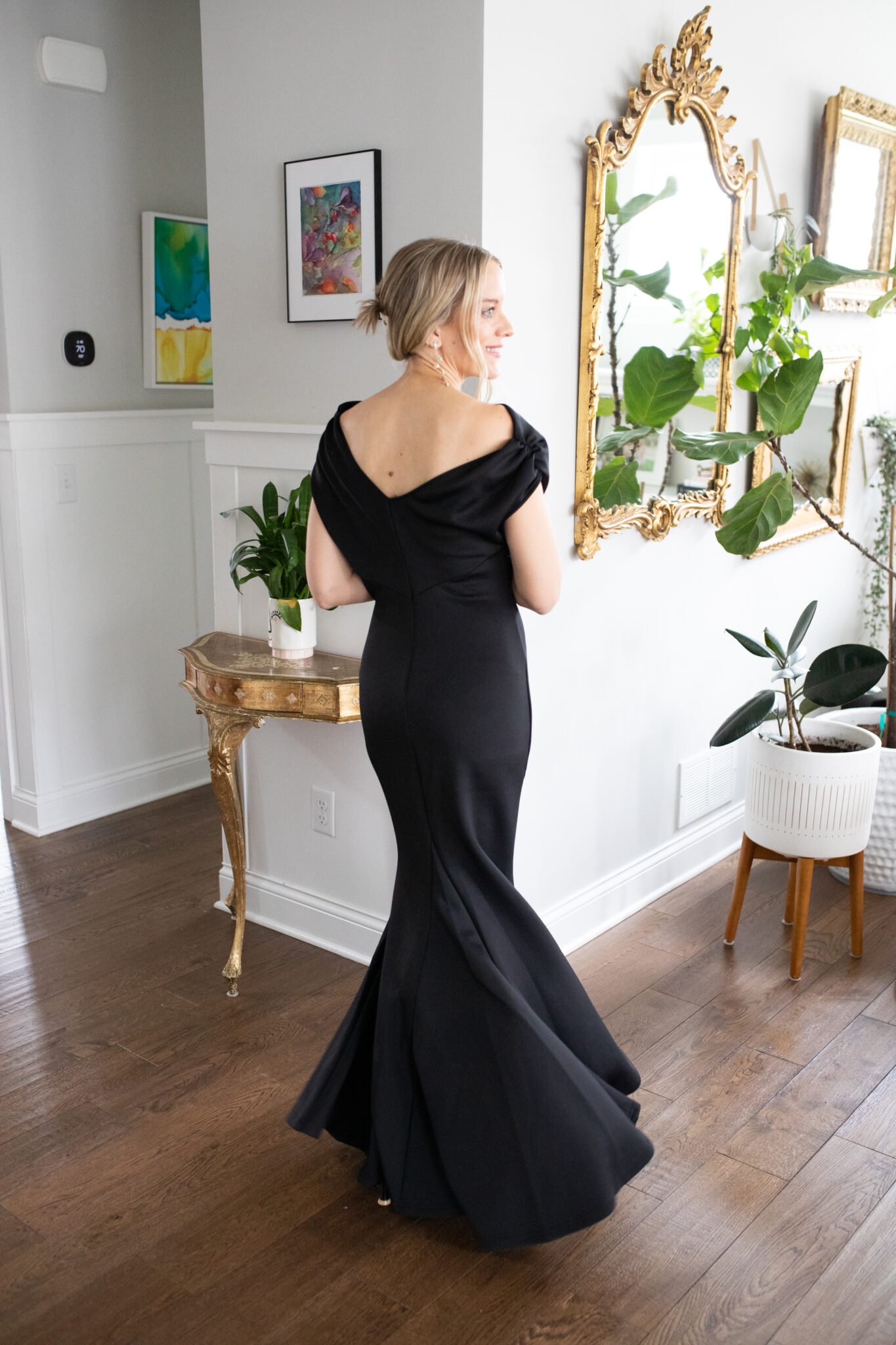 Sleek black off-shoulder bodycon maxi dress, perfect as a cocktail Wedding Guest dress or formal evening events.