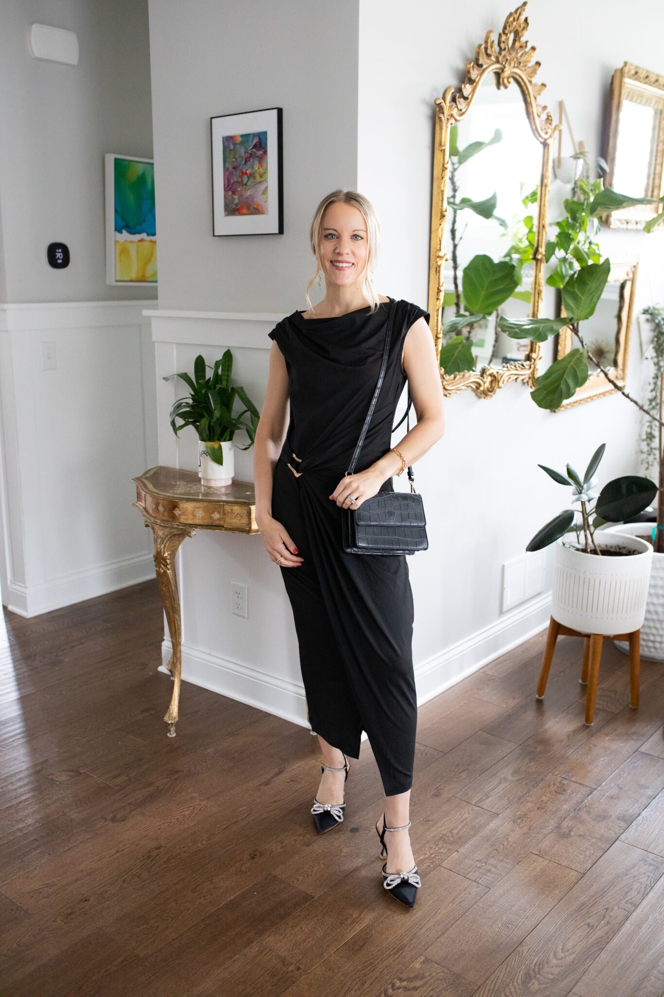 Mock neck bodycon midi dress with a gold clasp on the side to cinch the waist, styled with rhinestone bow slingback kitten heels.