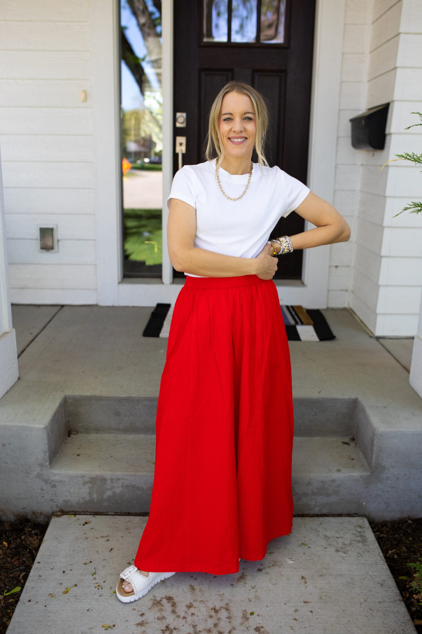 Classic A-line maxi skirt styled with a tucked-in white top for a timeless summer outfit.