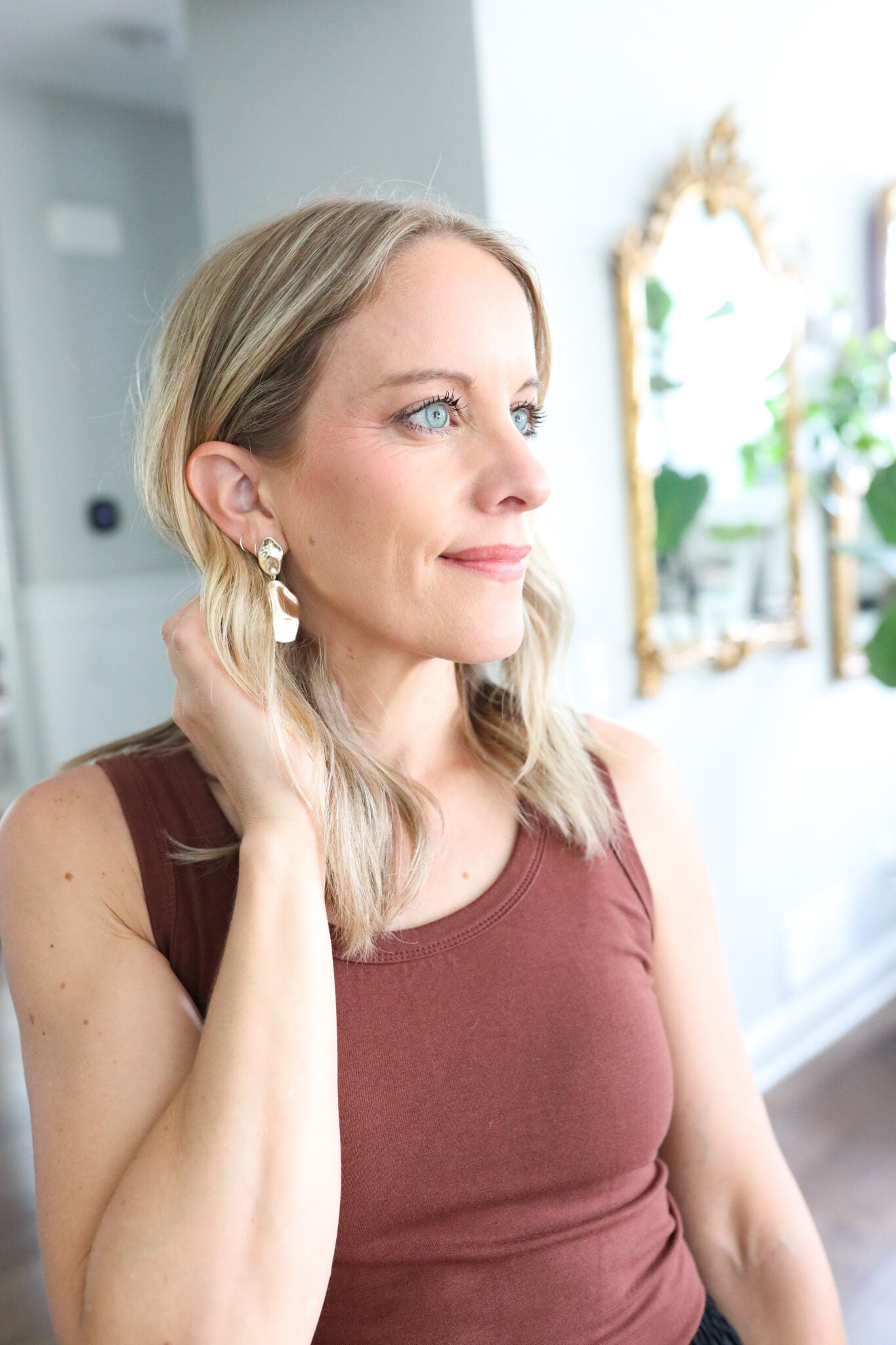 Jen wearing PAVOI 14K Gold Plated 925 Sterling Silver Teardrop Statement Dangle Earrings, showcasing their hammered design.