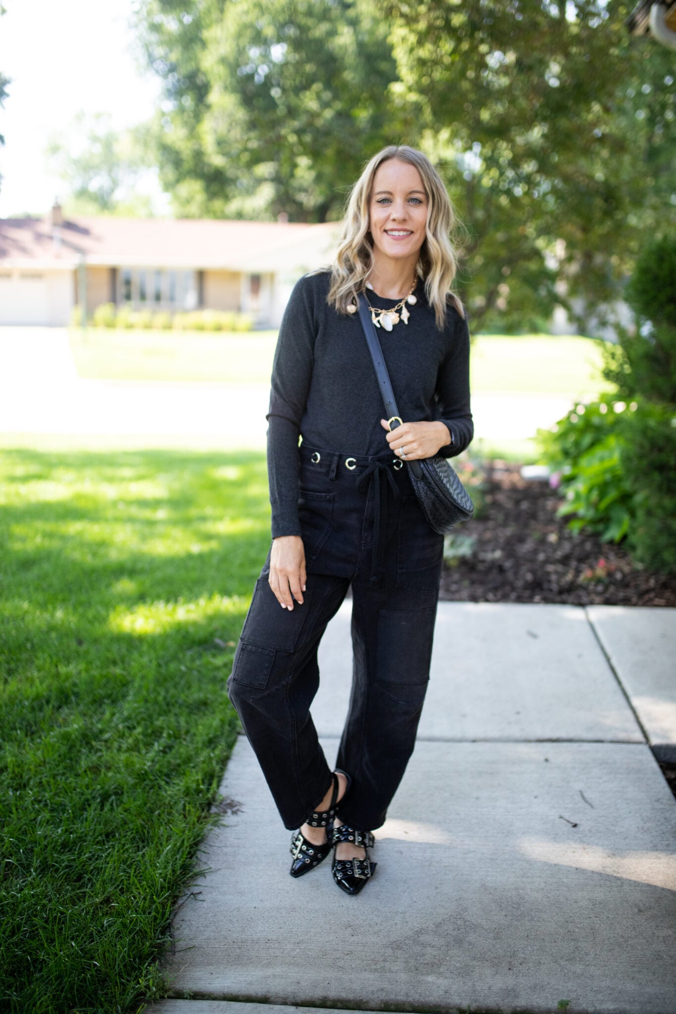 Patchwork barrel jeans styled with a charcoal long sleeve top and black flats for an easy fall outfit.