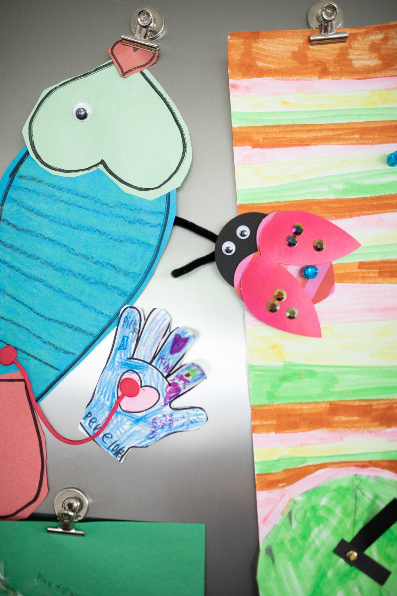 magnets holding artwork