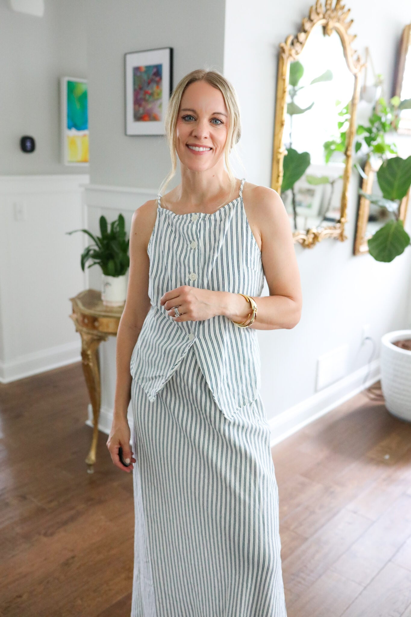 Jen wearing a navy striped linen vest and matching maxi skirt from Target styled with neutral accessories.