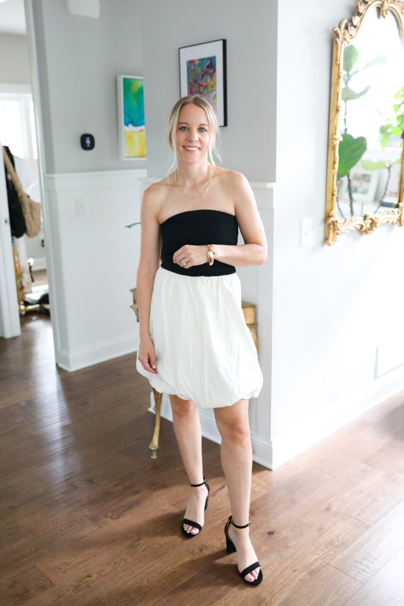 Jen wearing a black and cream strapless bubble dress from Target, styled with heels and minimal accessories.