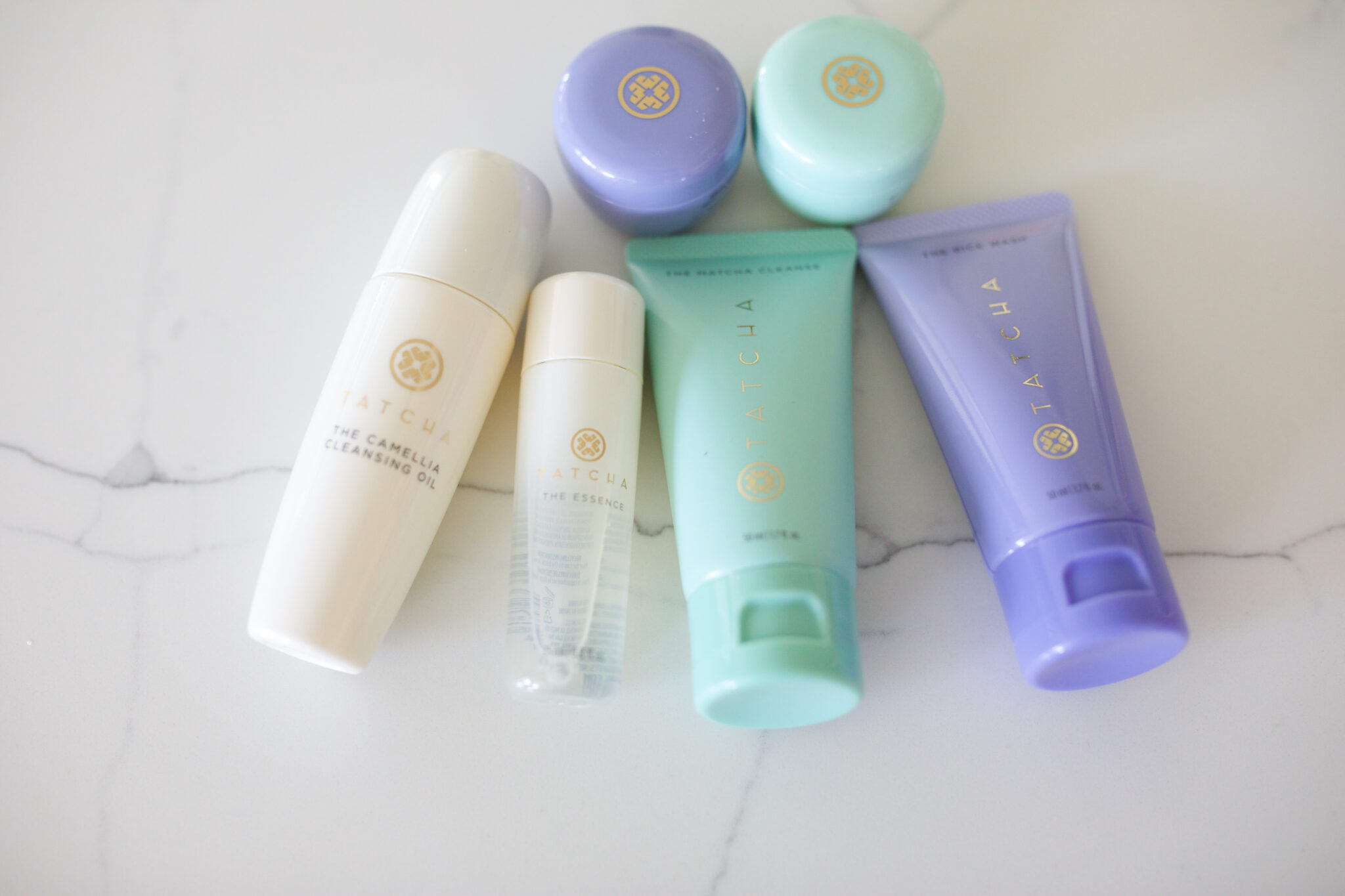 Tatcha travel size skincare set with cleanser, essence, and moisturizers