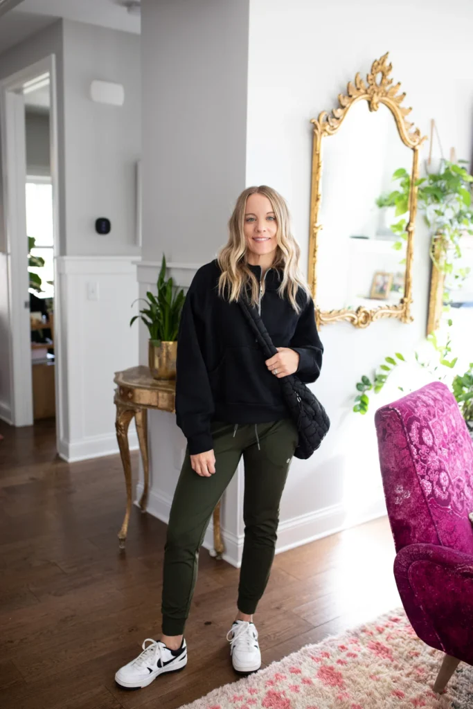 Woman wearing athliesure sweatshirt and fleece joggers