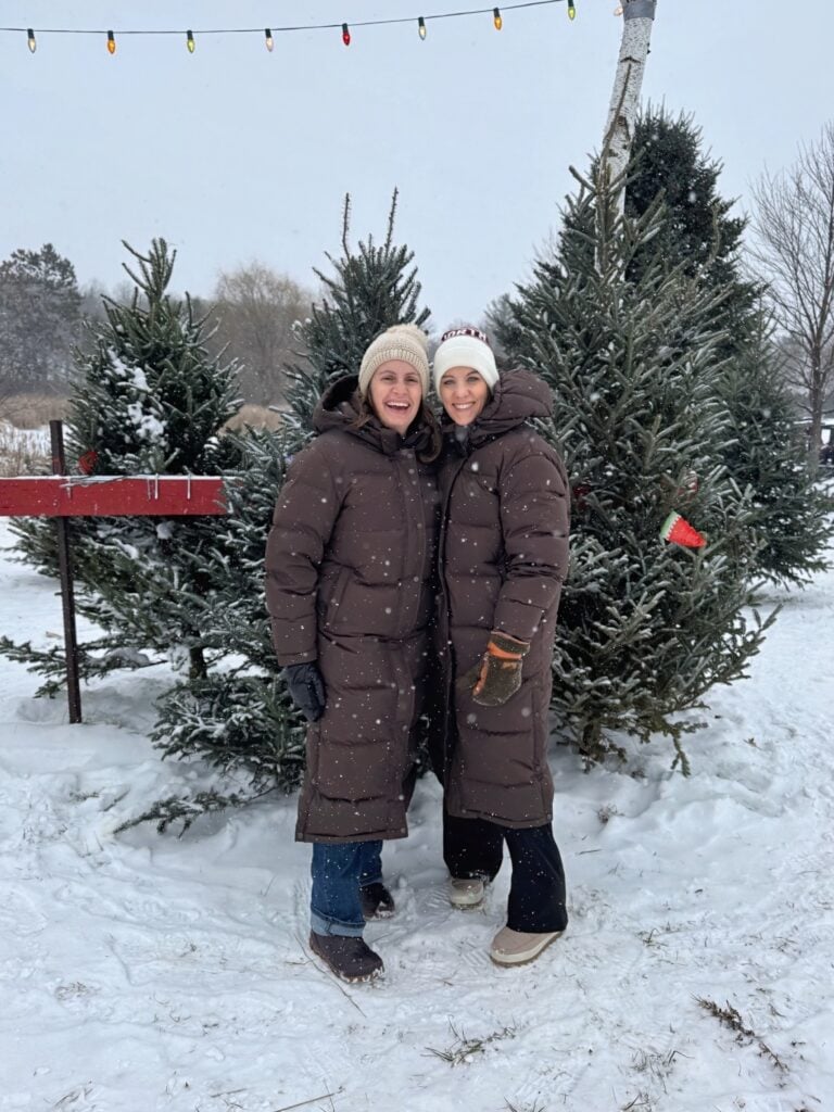 two women in Quince long puffer jackets
