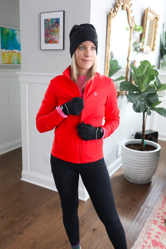 Woman in red winter runningn jacket.