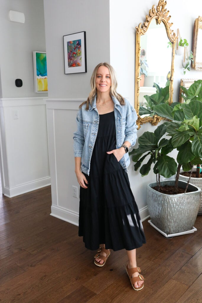 woman in black dress and denim jacket